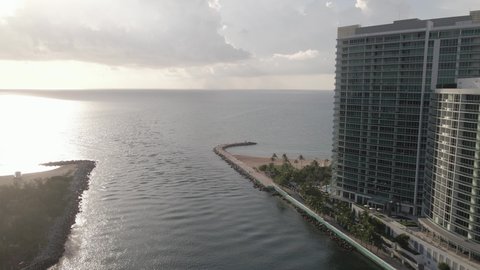 Silver sunrise aerial past Ritz-Carlton Bal Harbour in Haulover Inlet