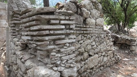Olimpos, Antalya, Turkey - 29th of May 2021: 4K Bricklaying of houses in the ancient Olimpos city
