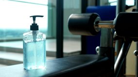 Hand sanitizer alcohol gel rub clean hands in gym. Hygiene prevention of coronavirus virus outbreak. Antiseptic, disinfection and healthcare lifestyle. Preventive measures during epidemic Covid-19 - Powered by Shutterstock - Get 15% off with code: PIKWIZARD15