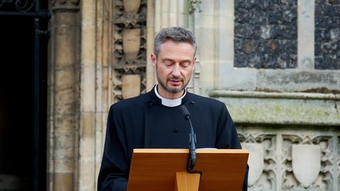 Norwich, Norfolk, United Kingdom. Circa August, 2021. Reverend Edward Carter conducts outdoor service at Church of Saint Peter Mancroft in Norwich.
