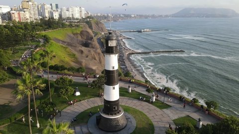 Miraflores, Perú, Marina Lighthouse in Miraflores we can see the pacific ocean in Costa verde as well as some people practicing parapente