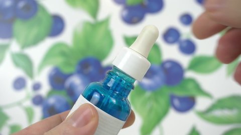 Anti-wrinkle facial drops serum with hyaluronic acid in macro view. Cosmetic treatments