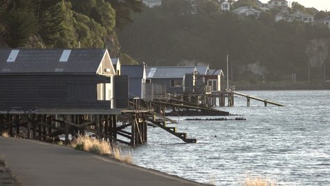 A group of boathouses in the evening light