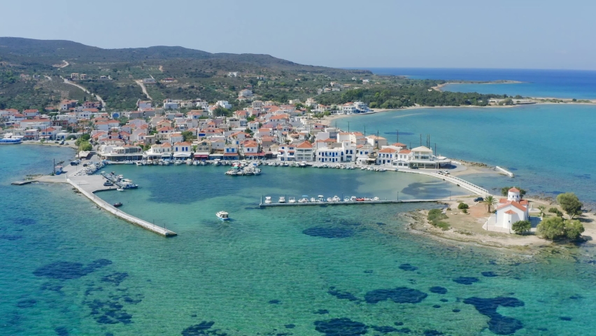 Elafonisos aerial drone view. Greek Island harbor buildings and Agios Spyridon church, Peloponnese Greece. 