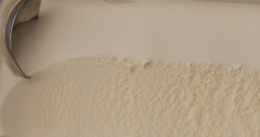Close Up Slow-motion scooping ice cream vanilla. | Shutterstock HD Video #1084802596