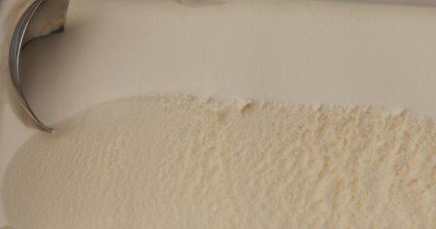 Close Up Slow-motion scooping ice cream vanilla.