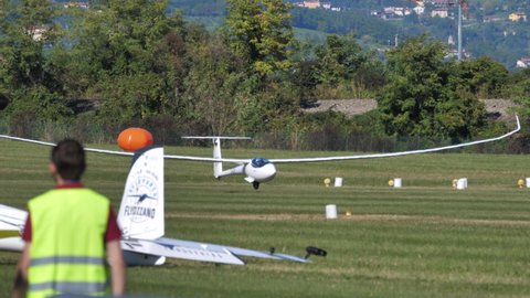 Thiene Italy OCTOBER, 16, 2021 Glider take off towing with rope by a lightweight airplane. Jonker Sailplanes JS3 Rapture modern aerodynamic high performance sailplane for distance competitions