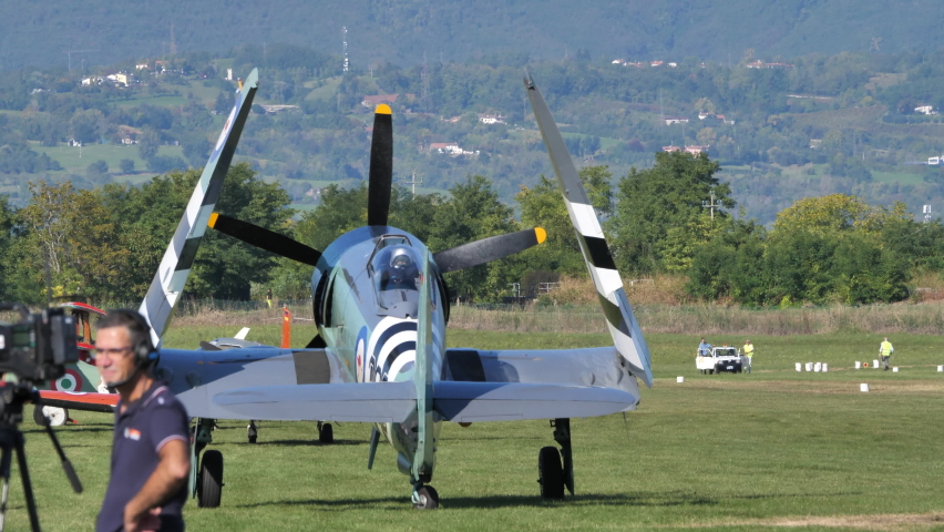 Thiene Italy OCTOBER, 16, 2021 Vintage military propeller airplane for navy carrier parked with folded wings. Hawker Sea Fury