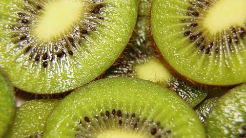 Close-up of kiwi cut, slowly rotating, rotation can be looped. Fresh and healthy kiwi fruits.