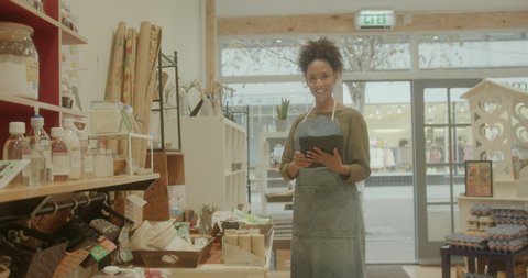 Portrait of successful Black Female Small Business Store Owner Looking At Camera