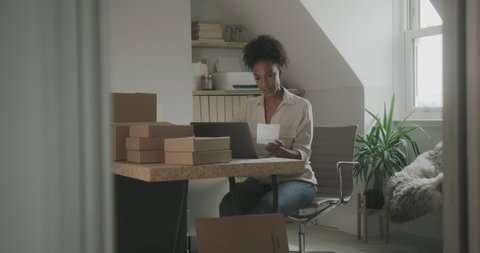 Woman Preparing Parcel Boxes for Shipment at Home, Entrepreneur