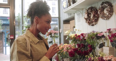 Young Female Customer Shopping in Florist Store