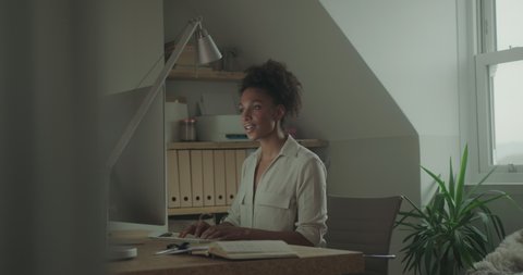Entrepreneur Black Woman Working at Home on Computer late at night