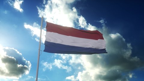 Flag of Netherlands waving at wind against beautiful blue sky