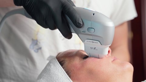 Ultrasound cosmetic procedure in beauty salon. skin rejuvenation therapy. close-up working tool of apparatus works with woman patient face skin. cosmetic dermatology complex
9.23.2021 Kyiv, Ukraine