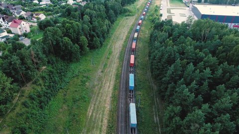 Cargo Containers Transportation On Freight Train By Railway. Intermodal Container On Train Car. Rail Freight Shipping Logistics Concept. Import - export goods