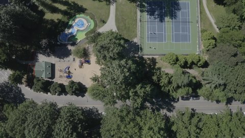 Top down aerial view over tennis courts and a playground in Burnaby, Greater Vancouver.
