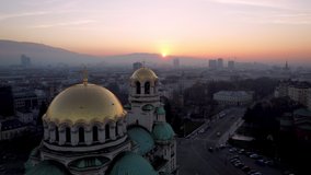 Sofia, Bulgaria February 2021. Video made with a drone at sunset over the golden domes of the St. Alexander Nevsky Cathedral in the capital.