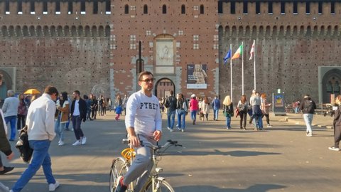 Milan , Italy - 10 20 2021: People visiting Castello Sforzesco or Sforza castle in Milan, Italy. Slow motion 4k at 120fps