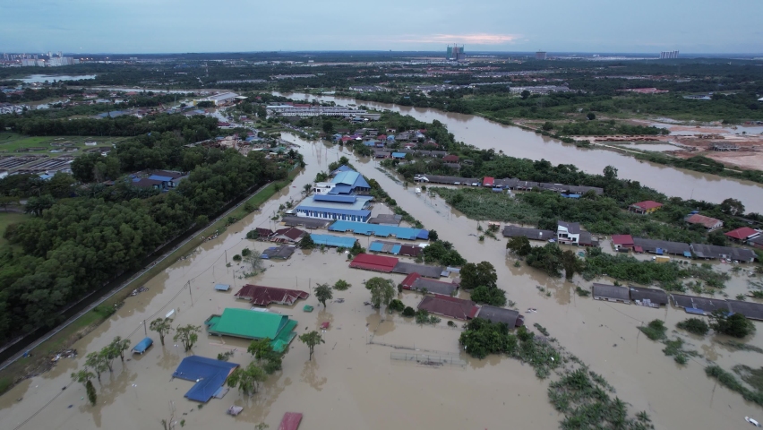 Aerial flying backwards over flooded Petaling district after heavy rain, Malaysia Royalty-Free Stock Footage #1084848703