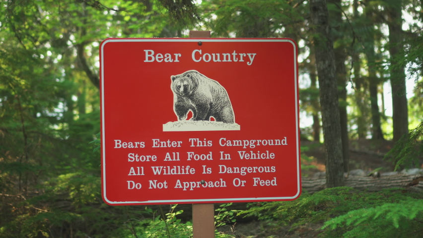 A Bear Country warning sign near a road inside Glacier National Park, Montana, U.S.A.Bear sightings in this area warning sign.
