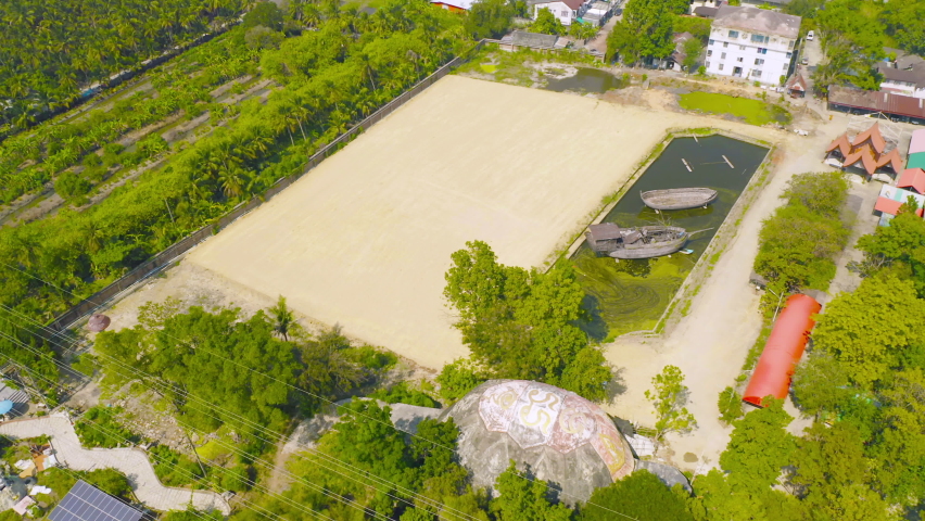 Aerial top view of dry ground rough cracks in the land with sand in factory industry for construction site. Arid pattern texture background.