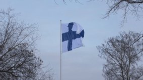 Finnish flag raised for Independence Day in Helsinki. - Powered by Shutterstock - Get 15% off with code: PIKWIZARD15