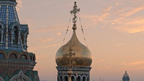 Close up view of golden dome. Church on sunset sky aerial shot 