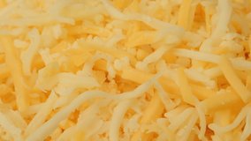 Grated cheese extreme close up rotating very slowly stock footage