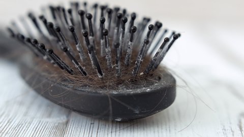 Dirty black hairbrush stock footage