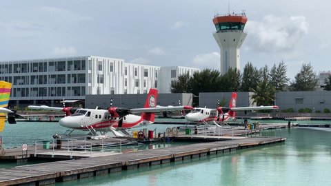 Male, Maldives - November 8 2021: A series of DHC-6 Twin Otter Turboprop Seaplane from Trans Maldivian Airways at Maldivian Seaplane Terminal