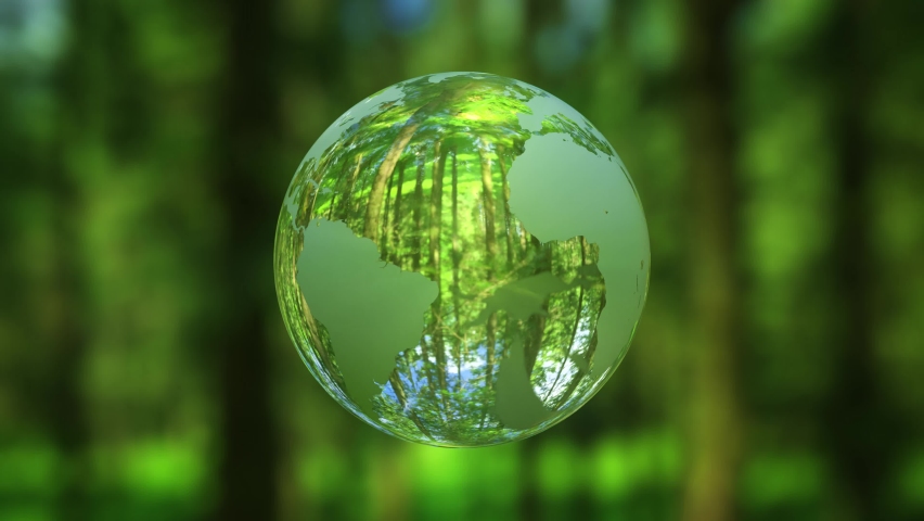 3D animation - Looped rotating crystal ball shaped planet Earth in a green forest 