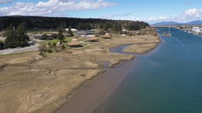 Cinematic 4K aerial drone dolly footage of the Cedar Hats at the Swinomish Village, by the Swinomish Channel in La Conner, a native American indian tribal reservation in Washington
