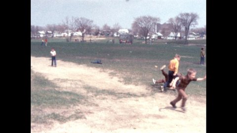1960s: Children on the playground. Boy smiling. Children on the swings. Children playing in the schoolyard.