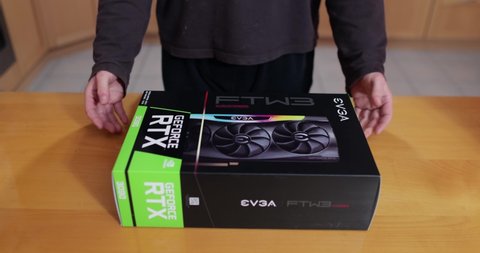 Budapest, Hungary - Circa 2020: Buying an Nvidia Geforce RTX 3090 Graphics Card made by EVGA in its box. High end GPU of the Nvidia RTX 30 series hard to get because of shortage lasting well into 2021