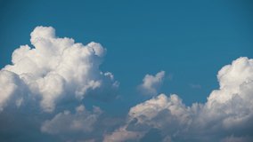 Timelapse of white puffy cumulus clouds forming on summer blue sky. Moving and changing cloudscape weather - Powered by Shutterstock - Get 15% off with code: PIKWIZARD15