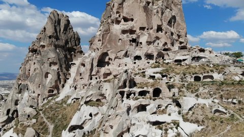 Aerial view of natural rock formations, valley with cave houses in Cappadocia, Turkey. Natural landscape.