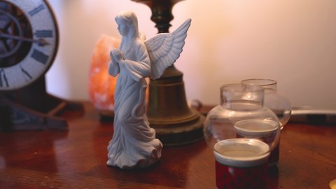 Christmas angel sitting on a table.