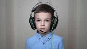 Portrait boy wear a headphone at home.
