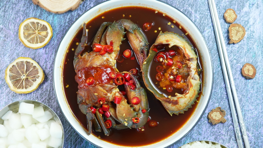 Korean Soy Sauce Pickled Crab, Fresh raw crabs marinated in a mild soy sauce, Ganjang Gejang Korean traditional food. Royalty-Free Stock Footage #1084902058