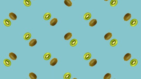 Colorful fruit pattern of fresh rotating kiwi. Seamless pattern with kiwi sliced on blue background. Realistic animation. 4K video motion