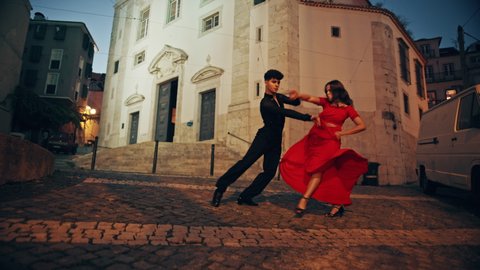 Beautiful Couple Dancing a Latin Dance on the Quiet Street of an Old Town in a City. Dance by Two Professional Dancers in the Evening in Ancient Culturally Rich Tourist Location.