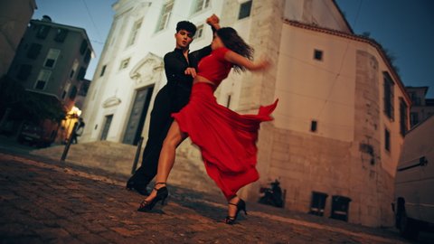 Beautiful Couple Dancing a Latin Dance on the Quiet Street of an Old Town in a City. Dance by Two Professional Dancers in the Evening in Ancient Culturally Rich Tourist Location.