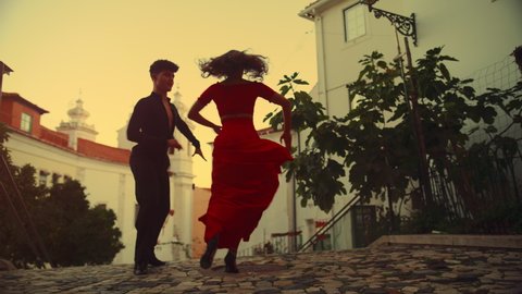 Beautiful Couple Dancing a Latin Dance on the Quiet Street of an Old Town in a City. Dance by Two Professional Dancers on a Sunset in Ancient Culturally Rich Tourist Location.