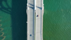 Looking down at the aerial video of the car driving on the cross-sea bridge,