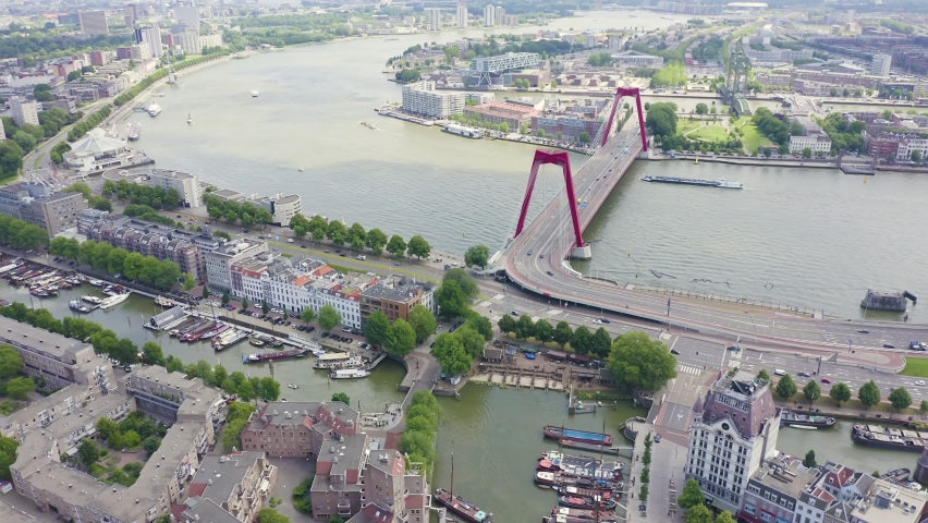 Inscription on video. Rotterdam, Netherlands. Williamsburg Suspension Bridge over the Nieuwe Maas River. Text from small balls, Aerial View