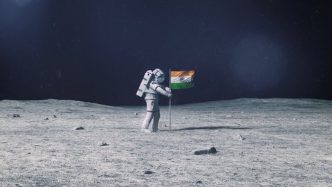 Astronaut in outer space on the surface of the moon. Planting India Indian flag.