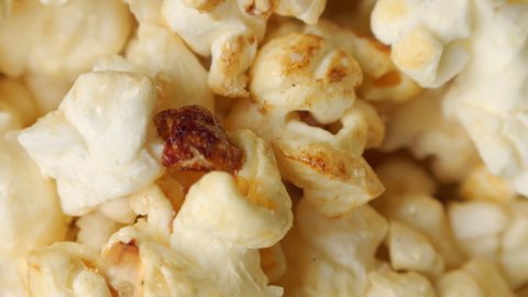 Popcorn heap background extreme close up rotating very slowly stock footage