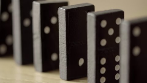 Dominoes falling against each other HD stock footage