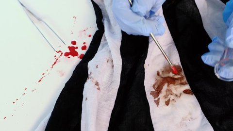 fresh splatter of blood on white table, stains on tissue at crime scene, blood sample collection tube, forensic scientist examining samples, forensic medical examiner work concept, police laboratory